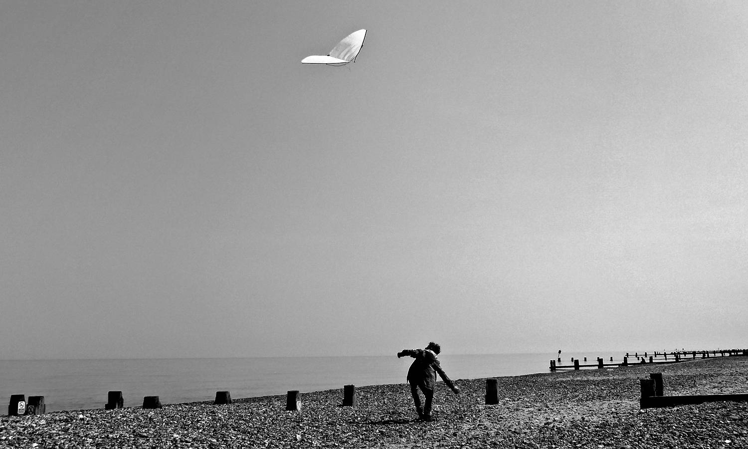 aA white kite above the east coast of England.