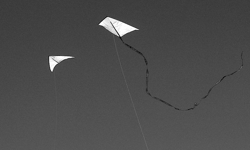 Two white kites at the kite festival Potsdam.