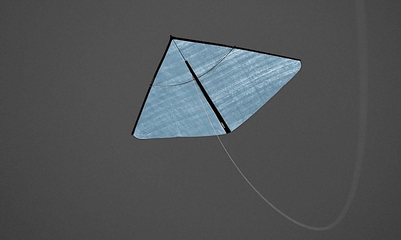 The blue translucent kite in a mellow breeze.