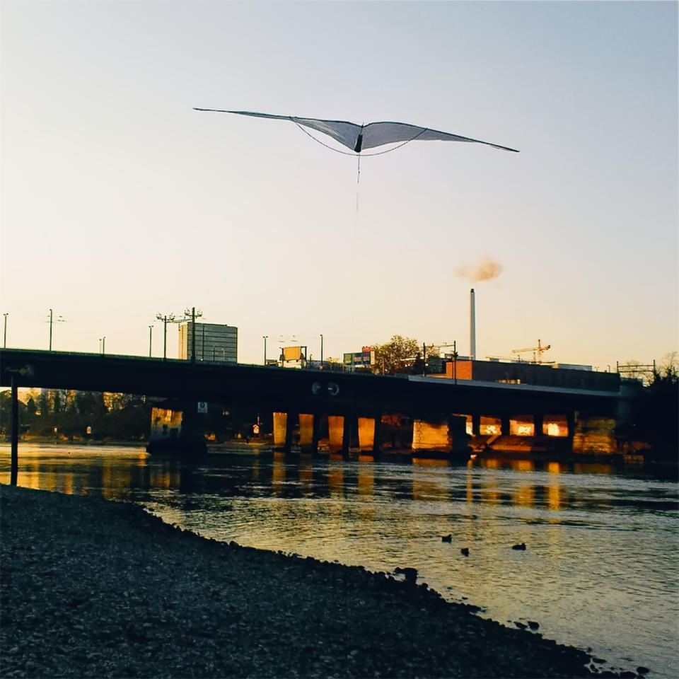 Kite floating above Rhein river.