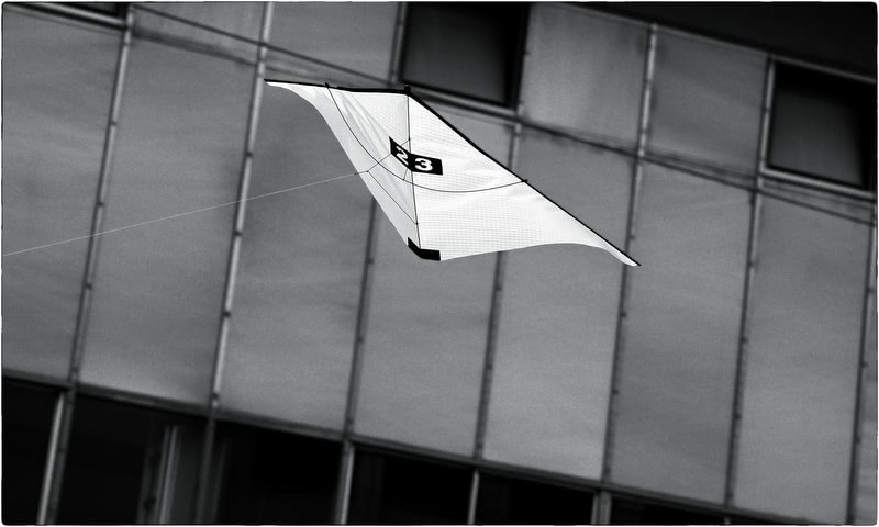 Zero-wind-kite-flying in urban industrial environment.