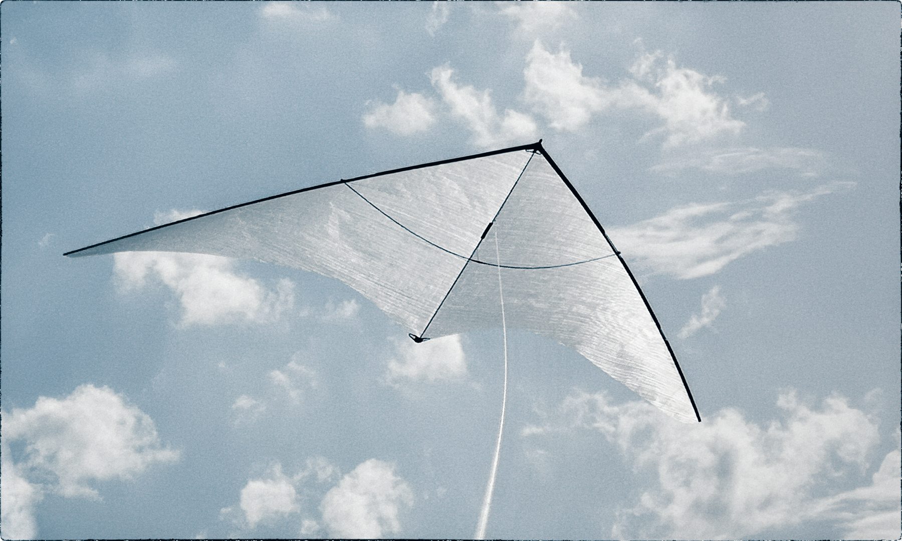leaving rome: the large zero wind kite in front of some clouds.