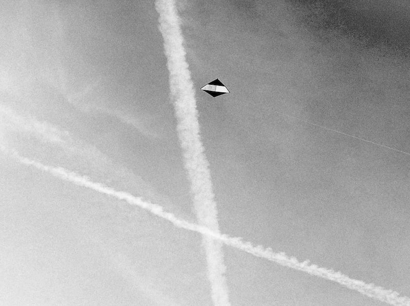 A lightwind kite in the blue sky.